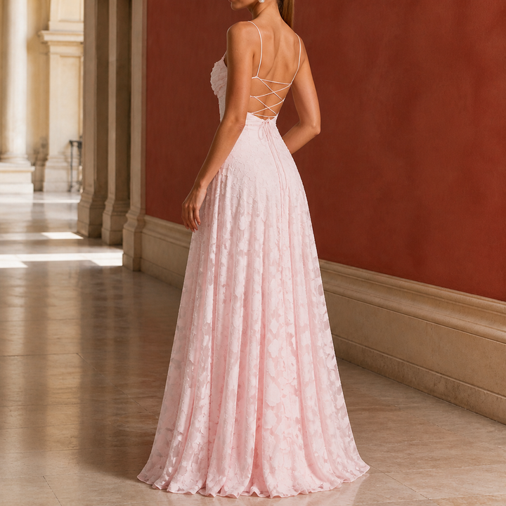 Elegant draped maxi evening dress in soft pink with floral texture for formal events