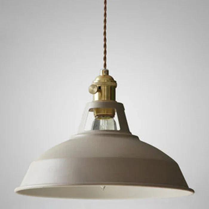 Khaki industrial retro pendant lamp highlighting the metal shade and brass fixture