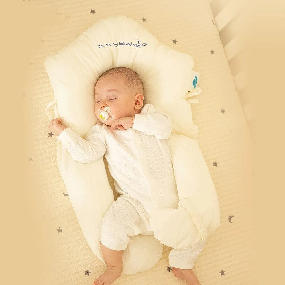 Baby lying securely in a specialized infant support pillow for daily naps