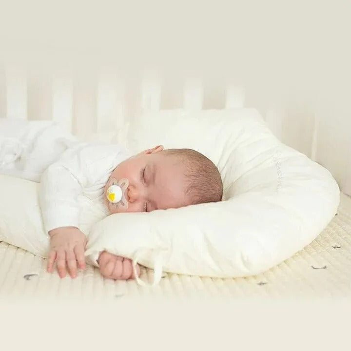 Baby support pillow showing built-in ergonomic head rest