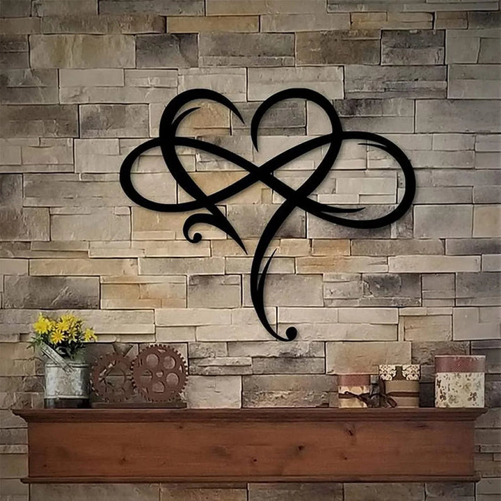 Heart and infinity wall decor mounted on a textured stone fireplace wall