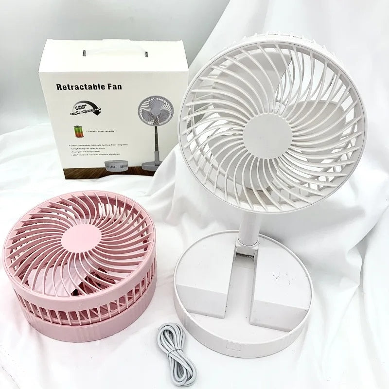 White portable rechargeable folding fan fully extended on flat surface