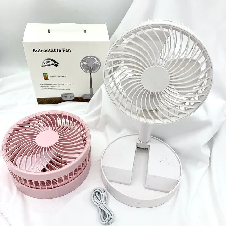White portable rechargeable folding fan fully extended on flat surface