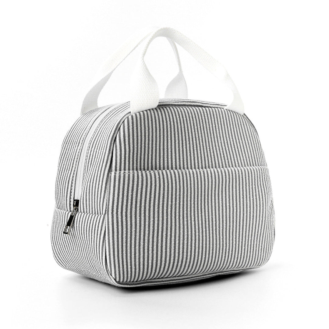 Insulated lunch tote packed with food containers for daily work meals