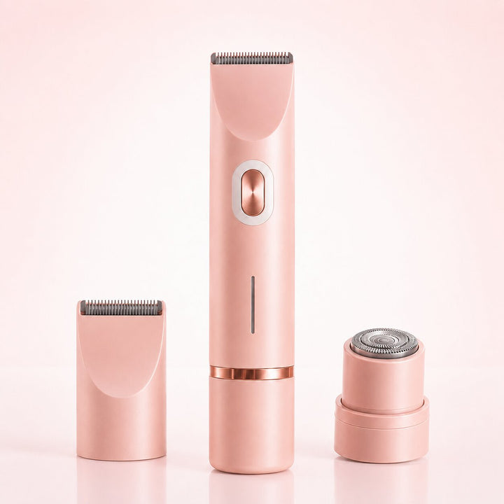 Pink women's intimate shaver with two interchangeable attachments on a pink background
