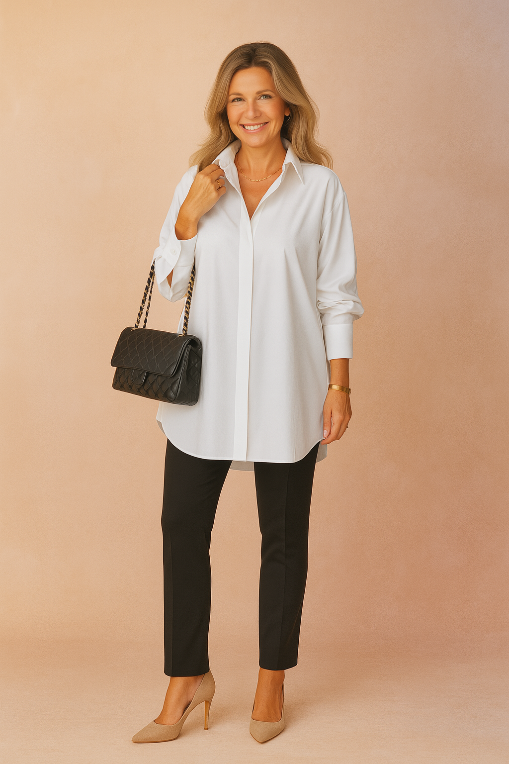 Woman wearing white oversized shirt blouse with black trousers and heels
