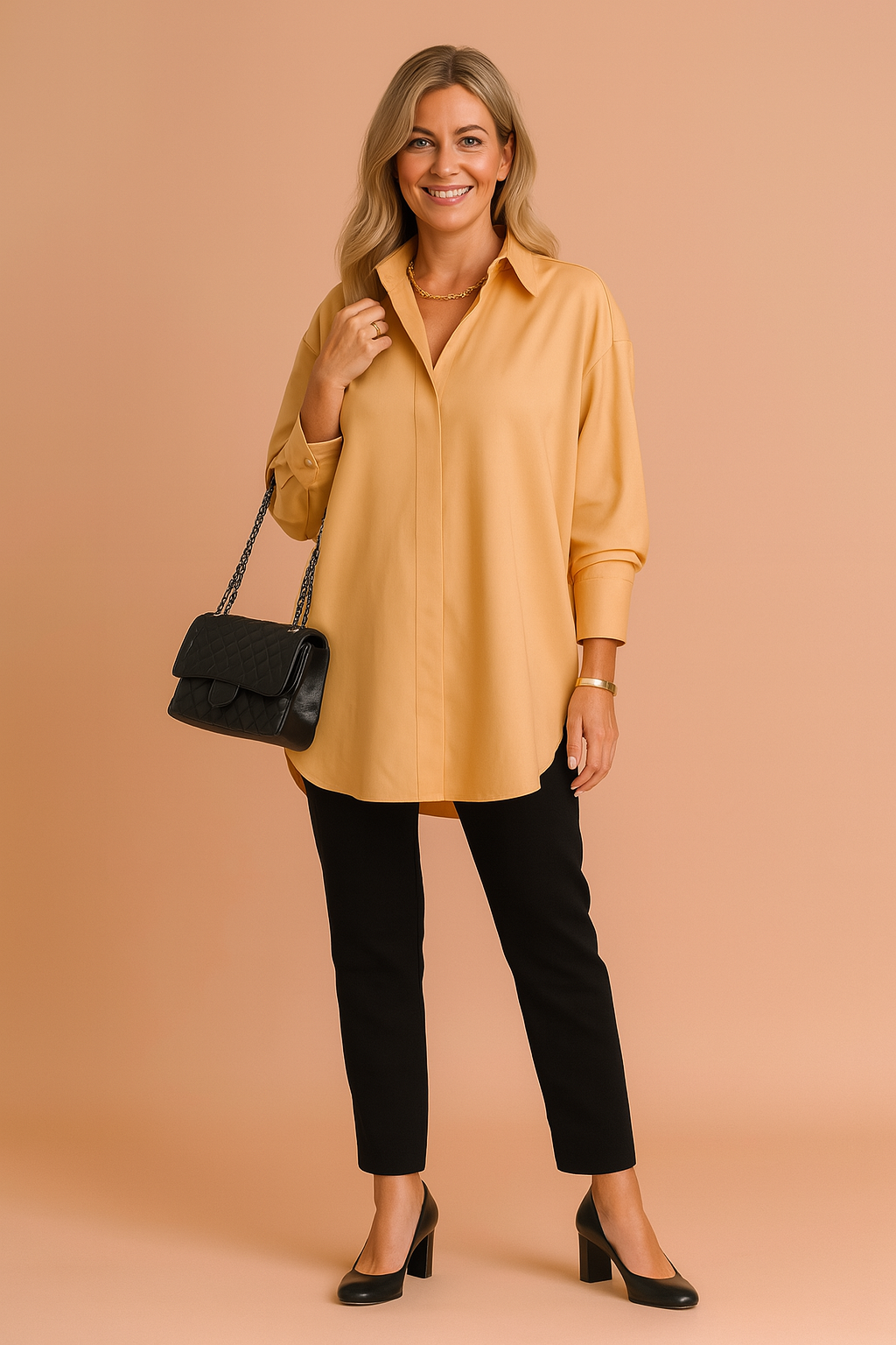 Woman wearing yellow oversized shirt blouse with black trousers