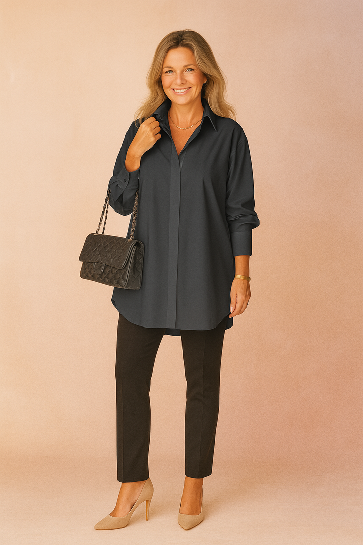 Relaxed fit casual top featuring a classic collar and button-down design