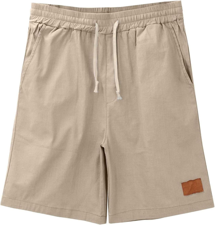 Folded stack of men's linen shorts in khaki, black, and white colors