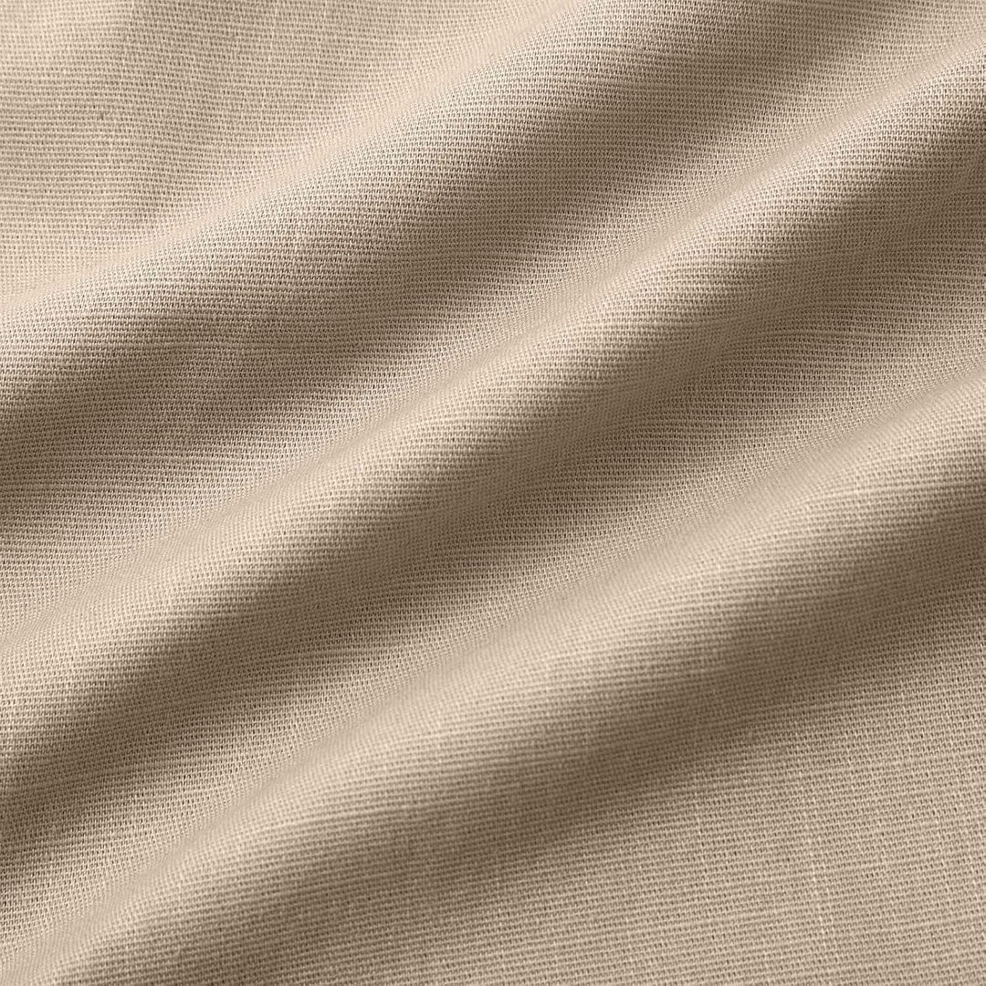 Close-up of hemline and stitching on men's relaxed fit summer shorts