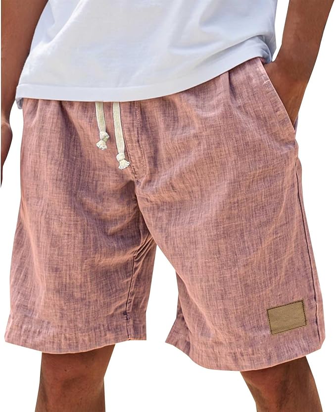 Man wearing pink relaxed fit drawstring shorts in warm weather