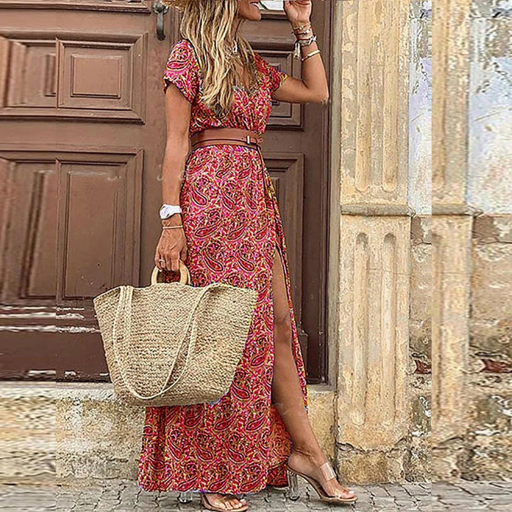 Side view of women's floral wrap maxi cocktail dress showing slit