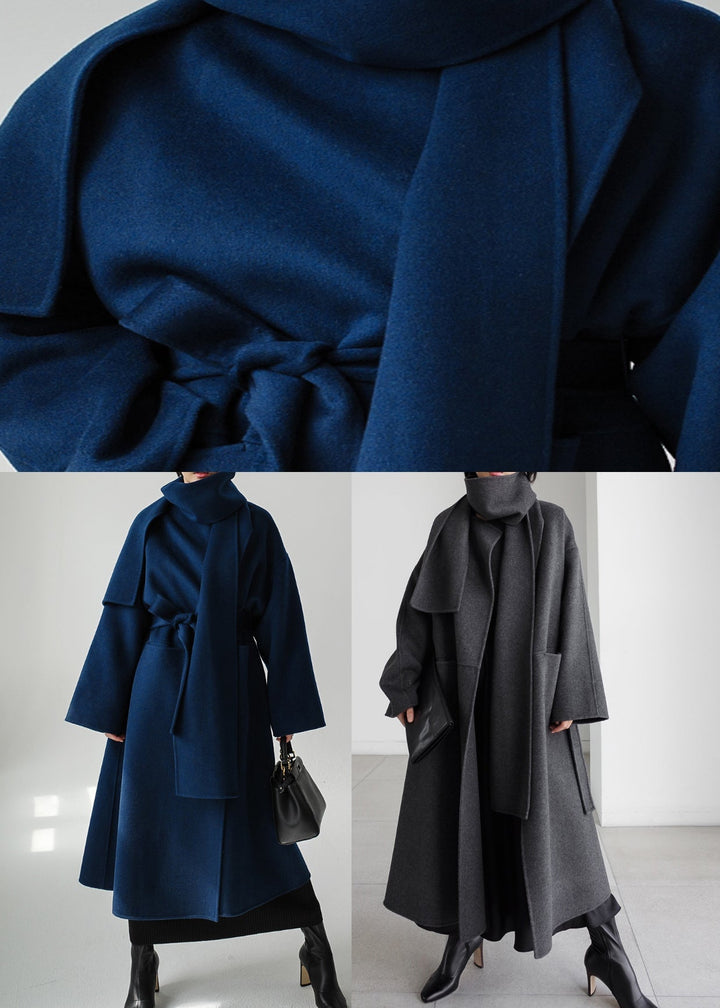 Close-up fabric detail of the warm grey women's tailored winter outerwear coat
