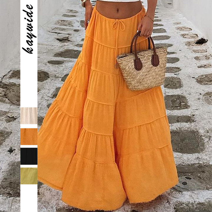 Bright orange tiered midi skirt with raw hem details