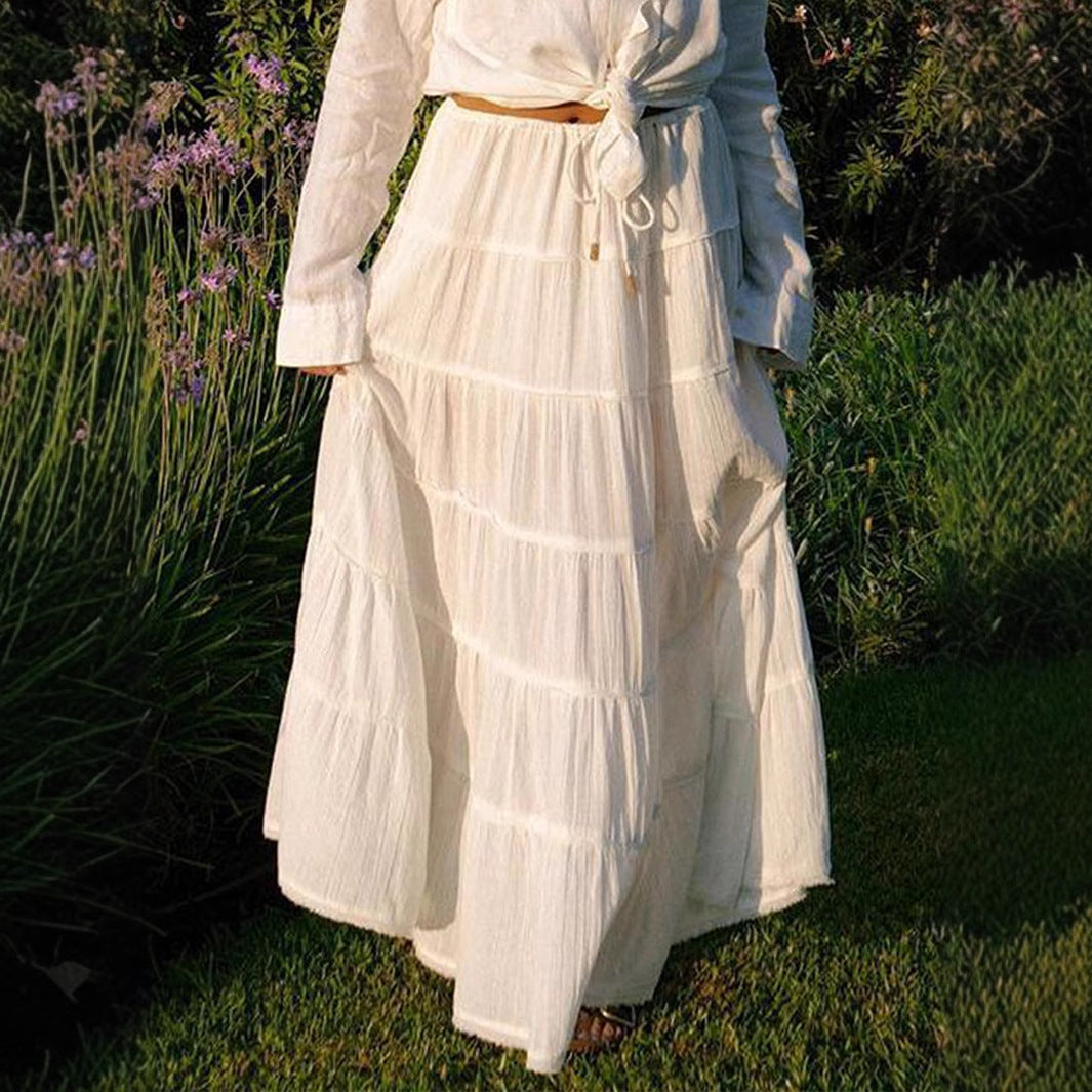 White flowing tiered midi skirt styled for a sunny day
