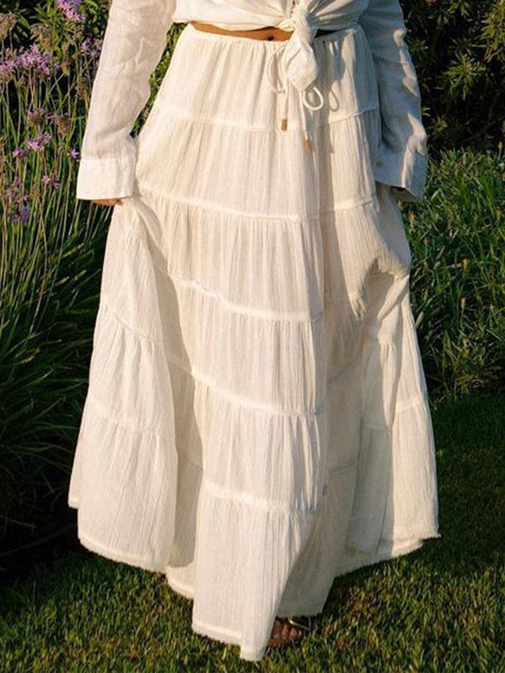 Back view of flowing tiered skirt styled for warm weather fashion