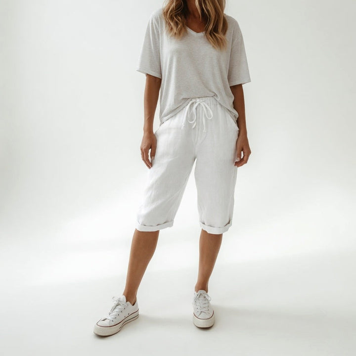 Side view of stylish relaxed-fit bermuda shorts for women