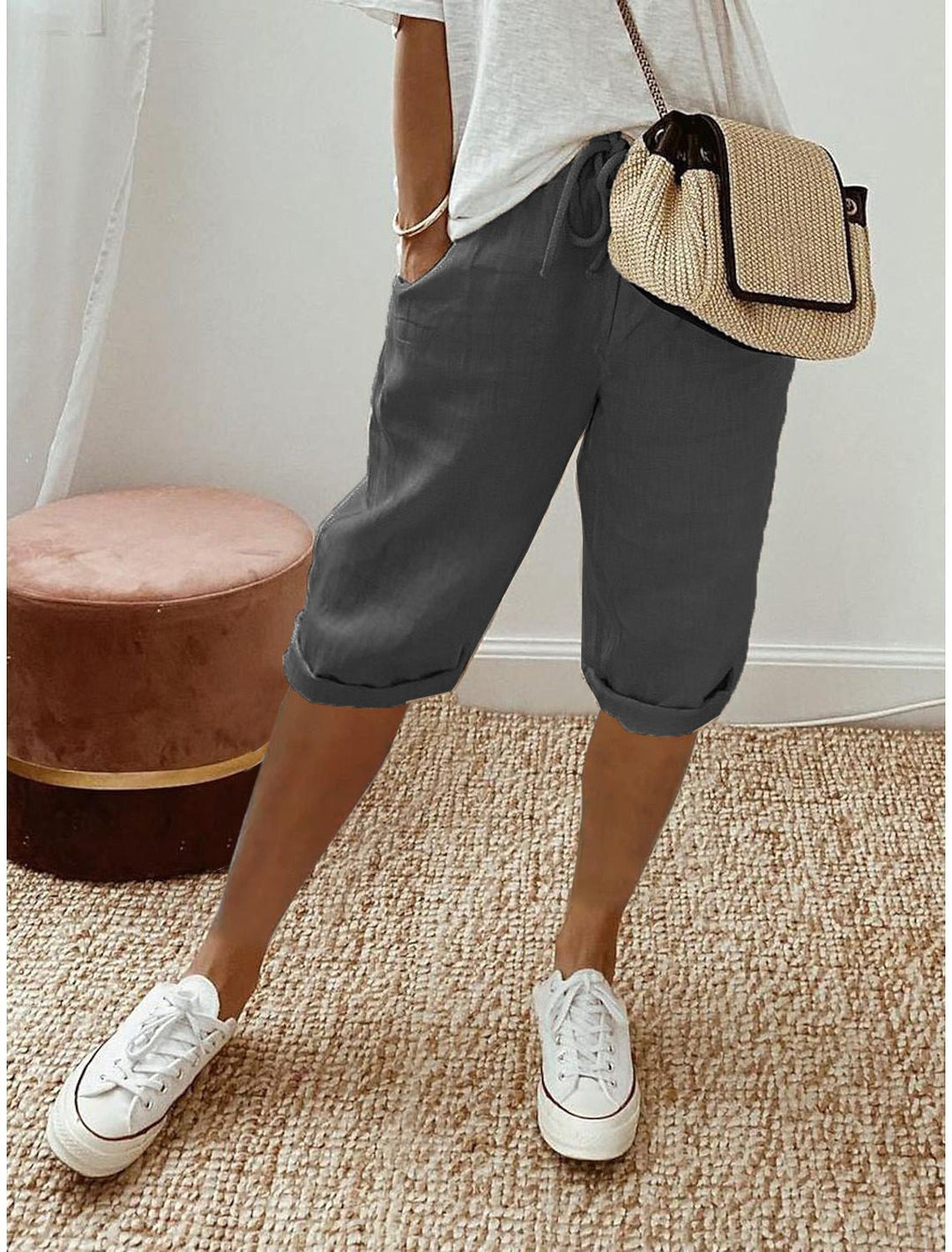 Back view of women's khaki bermuda shorts showing pocket details