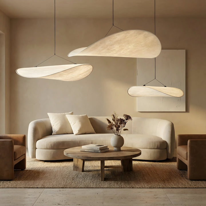 Multiple Japandi style hanging lights creating a warm ambiance in a modern interior