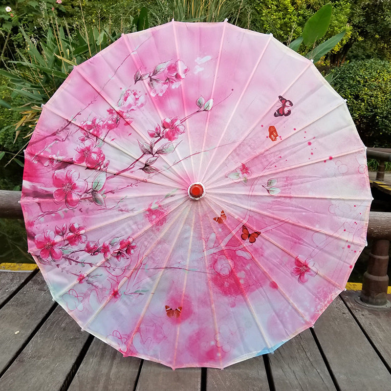 Pink Japanese UV protection parasol with cherry blossom pattern and butterflies