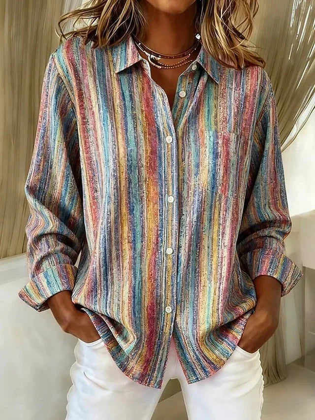Woman wearing multicolor striped button blouse with white jeans