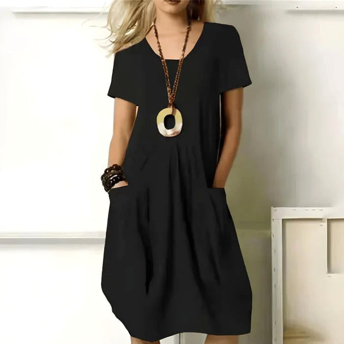 Casual green summer dress with short sleeves and pockets, relaxed fit for everyday wear