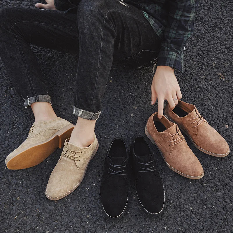 Man wearing stylish casual outfit sitting outdoors showcasing brown oxford shoes