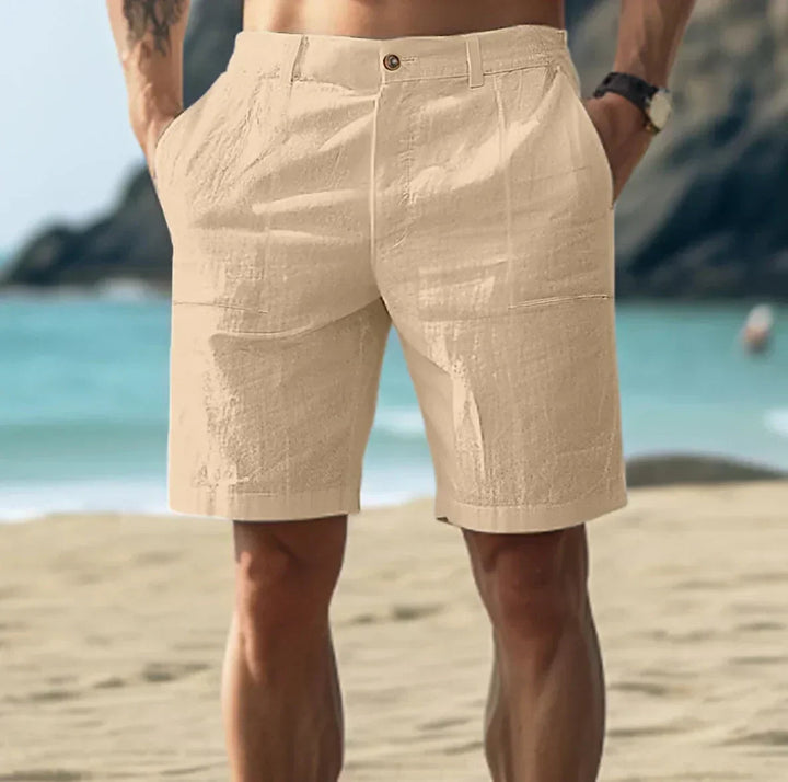 Man wearing khaki casual mid length shorts outdoors