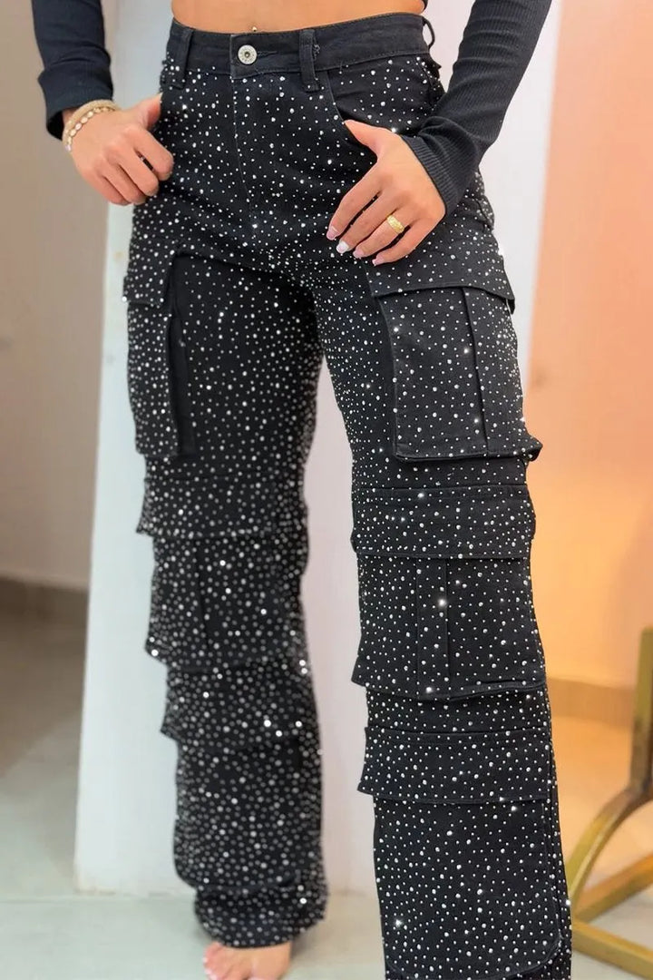 Detailed front view of women's black crystal-embellished cargo pants