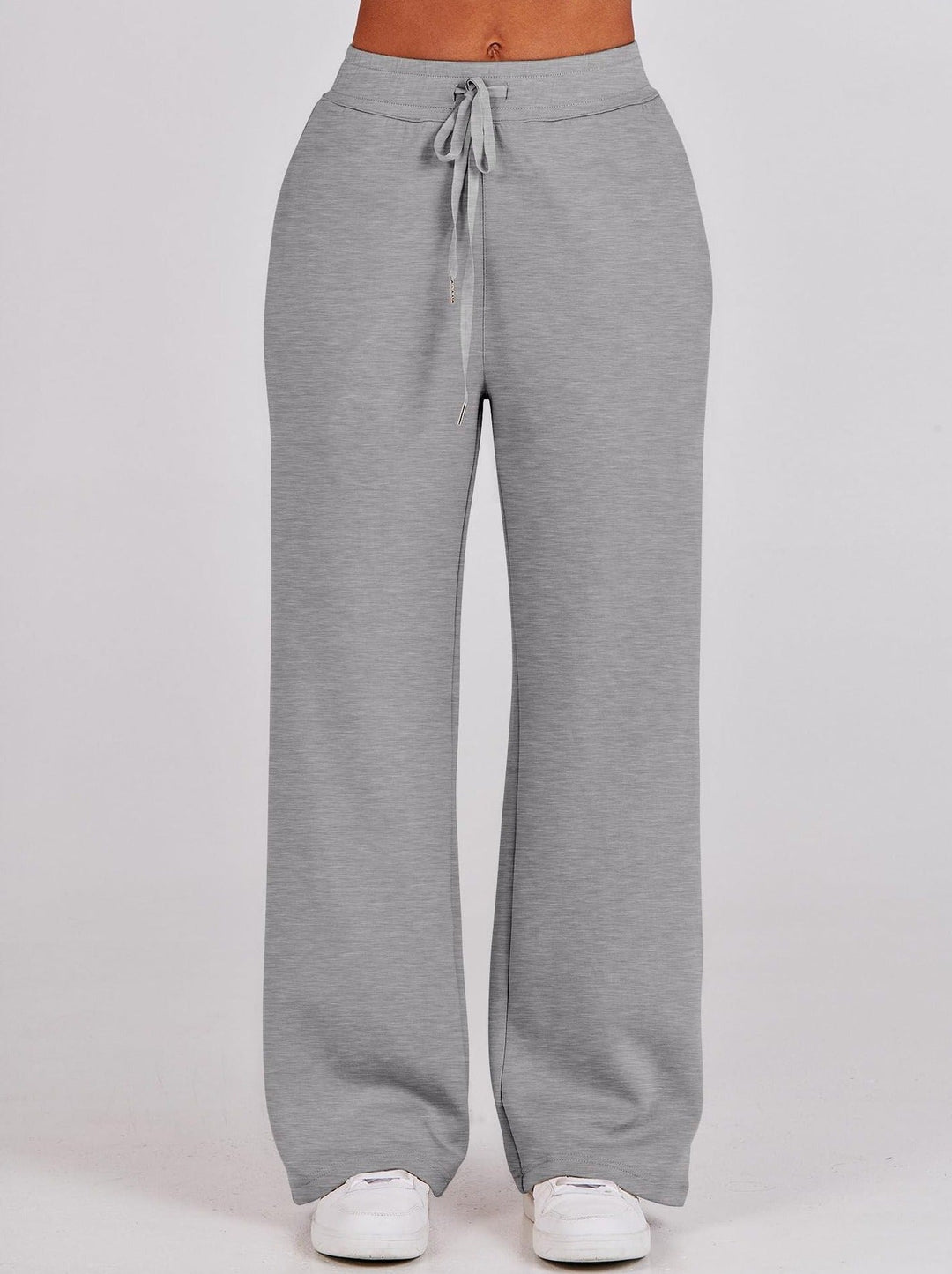 Front view of the straight-leg grey loungewear trousers featuring an adjustable drawstring waistband.