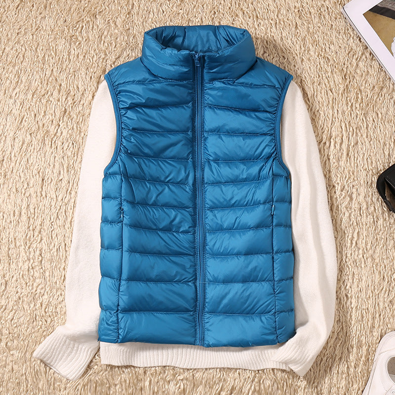 Folded view of the packable lightweight winter vest for women, ideal for travel.