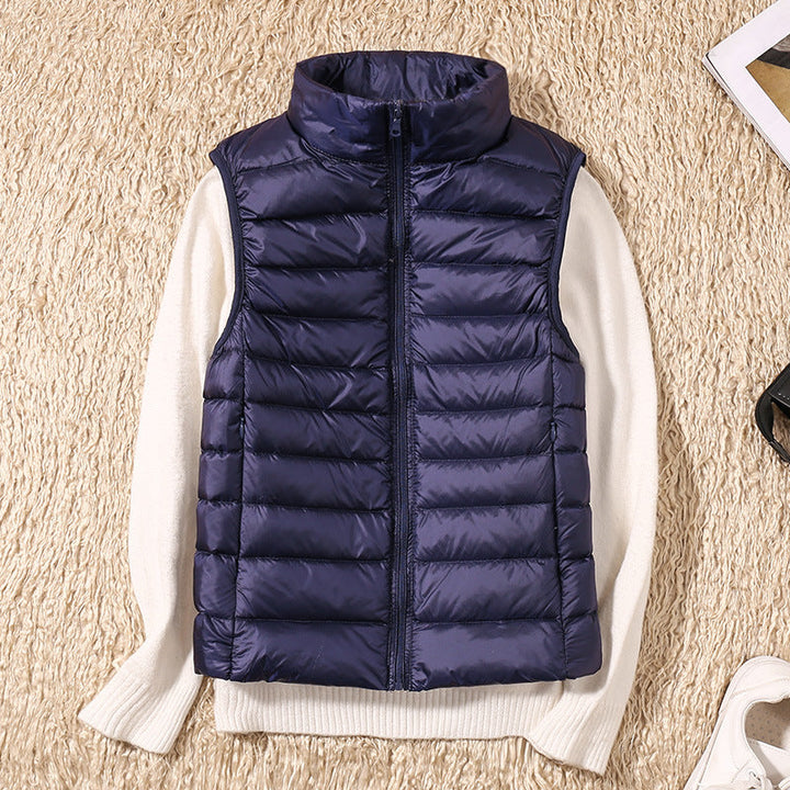 Back view of a sleeveless casual wear puffer vest for women, showing tailored fit.