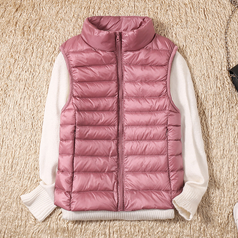 Women's lightweight quilted puffer vest in black, front view for casual layering.