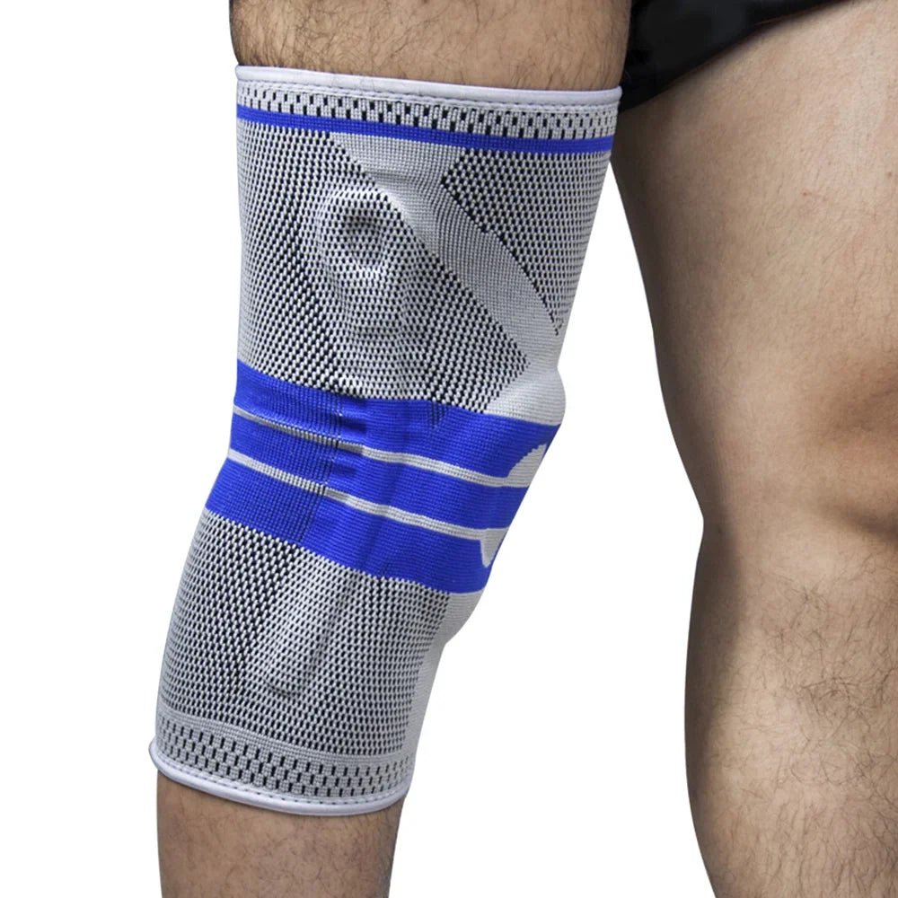 Unisex grey knee support brace worn on leg showing blue accent stripes