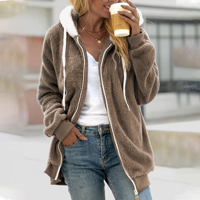 Woman wearing beige hooded zip-up longline coat