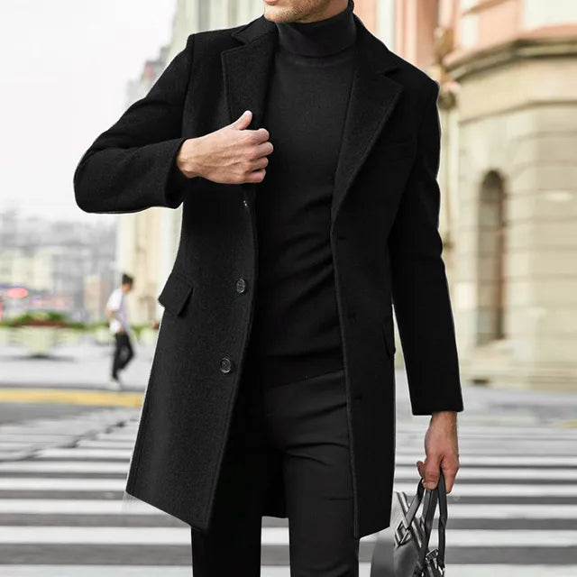 Close-up view of a man in a black classic winter overcoat