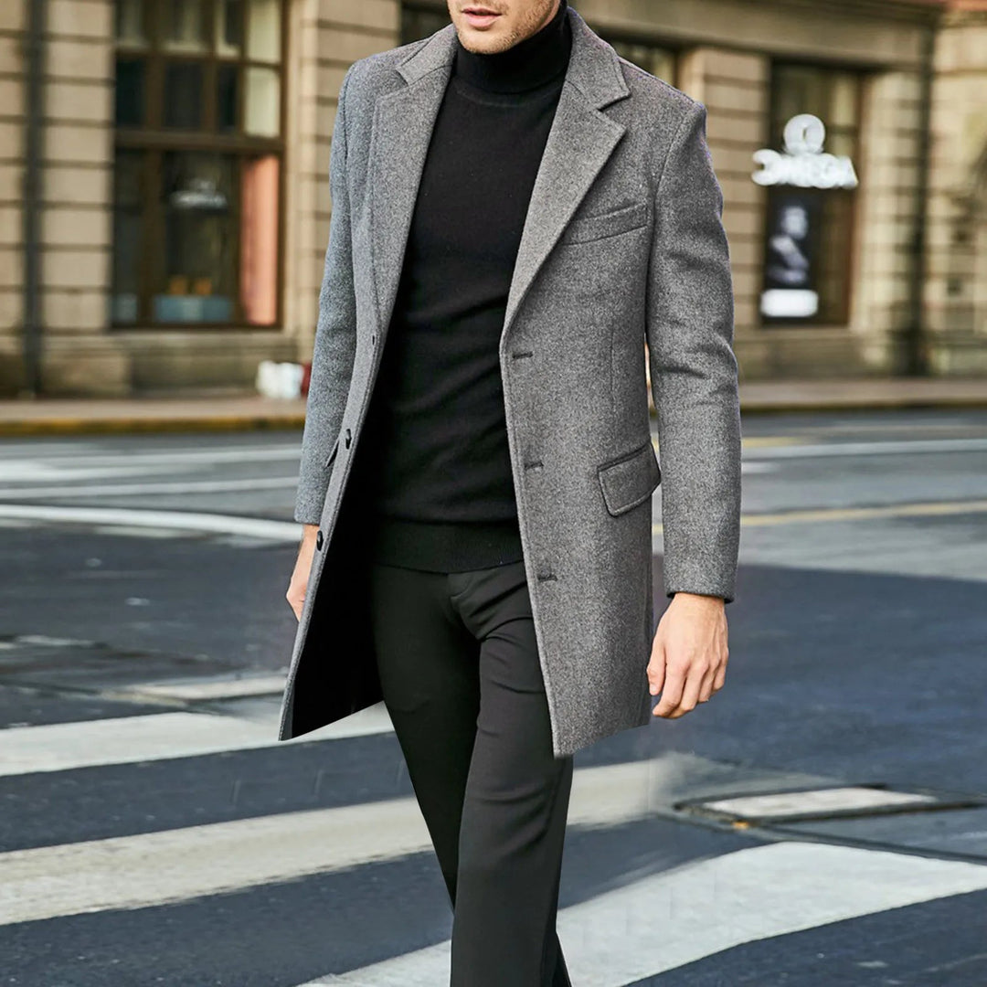 Back view of a black mens mid-length winter overcoat with notched lapel for business casual wear