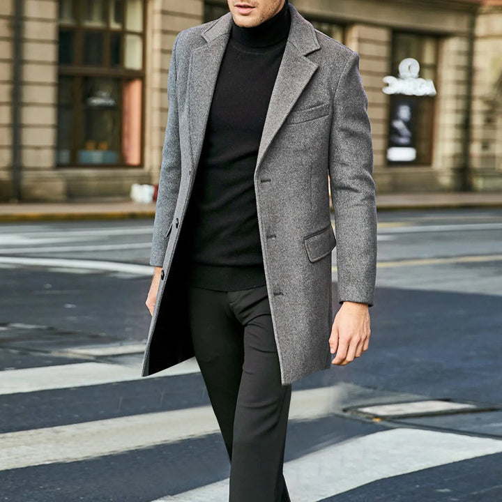 Back view of a black mens mid-length winter overcoat with notched lapel for business casual wear