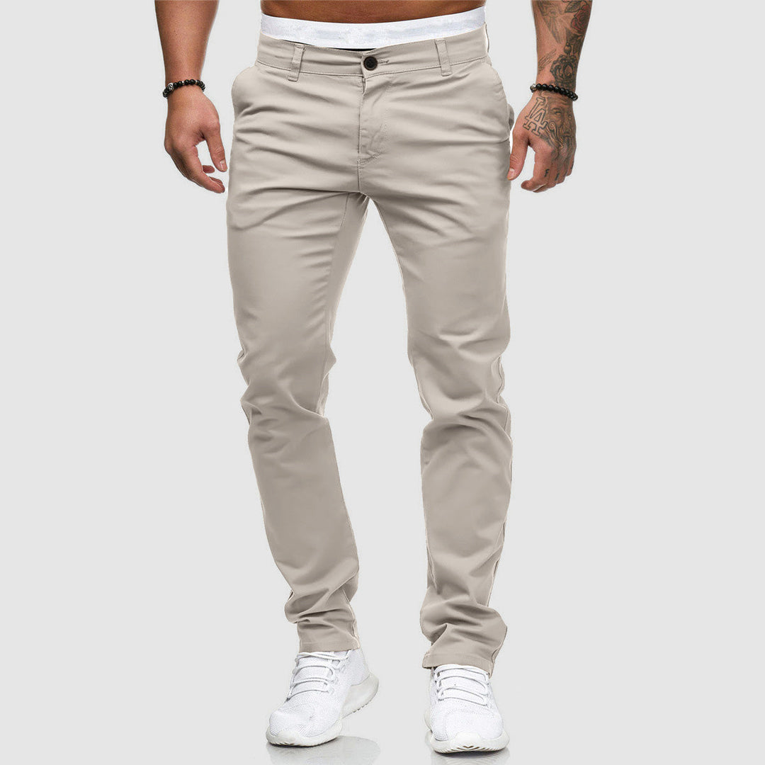 Close-up of slim fit trousers fabric and button closure detail