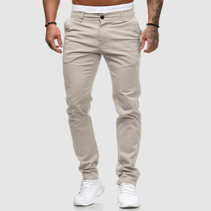 Close-up of slim fit trousers fabric and button closure detail