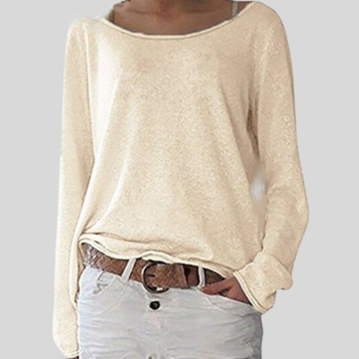 Woman wearing a beige relaxed fit long sleeve sweater