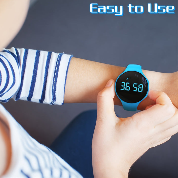 Child wearing a bright blue children's watch with a clear touch LED screen