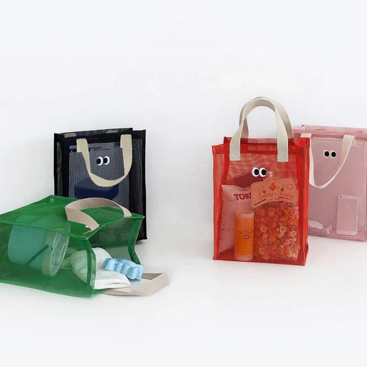 Side profile of a kids mesh beach tote bag with reinforced straps