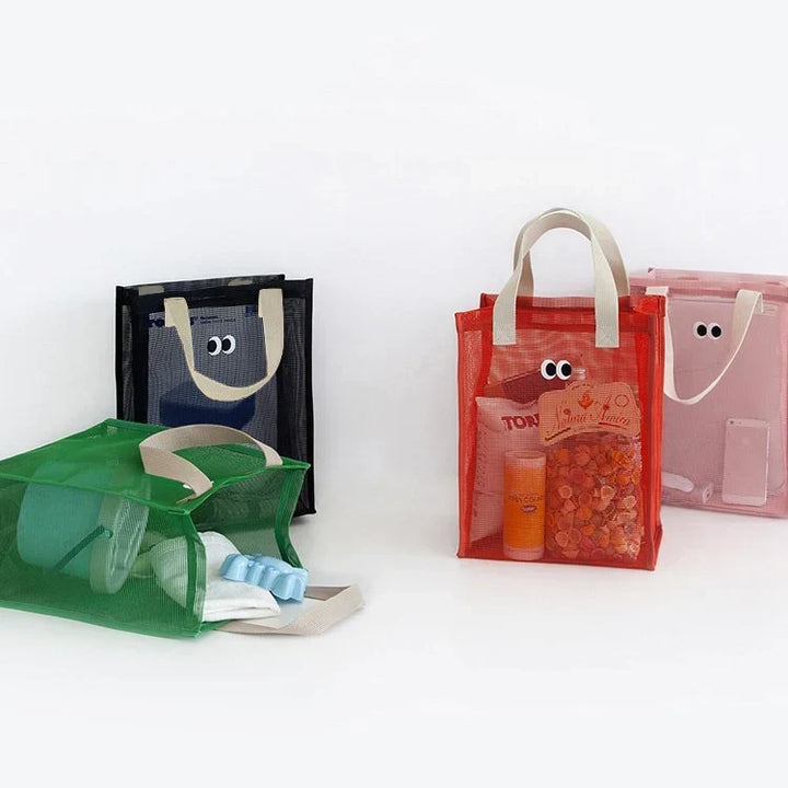 Side profile of a kids mesh beach tote bag with reinforced straps