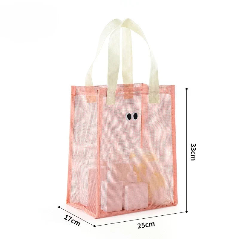 Pink kids mesh beach tote bag with upright structure and wide handles