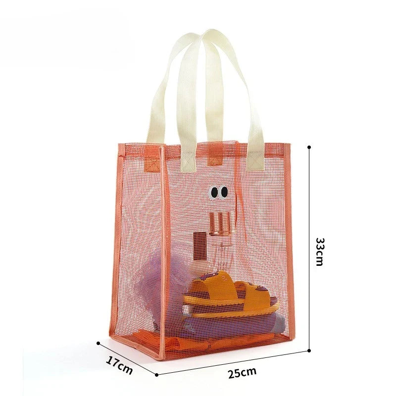 Kids mesh beach tote bag filled with colorful summer toys and sand-free gear