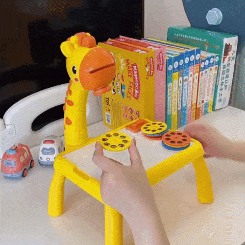 Child playing with educational toy drawing tablet in yellow color