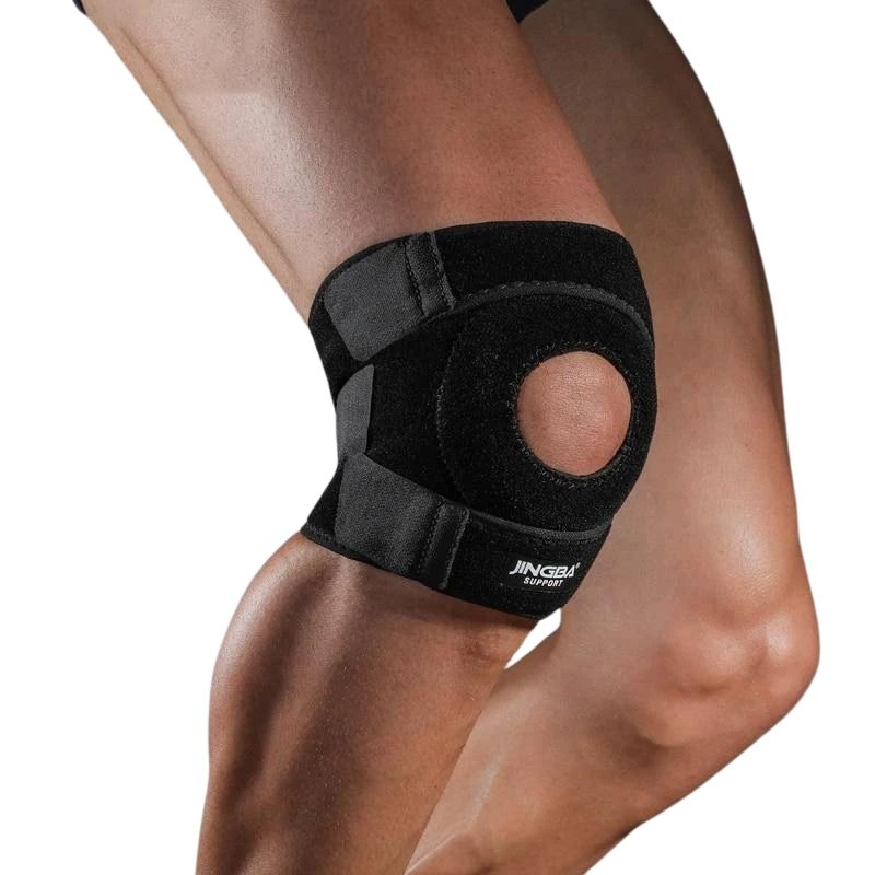 Unisex black knee brace worn on a leg demonstrating patellar support