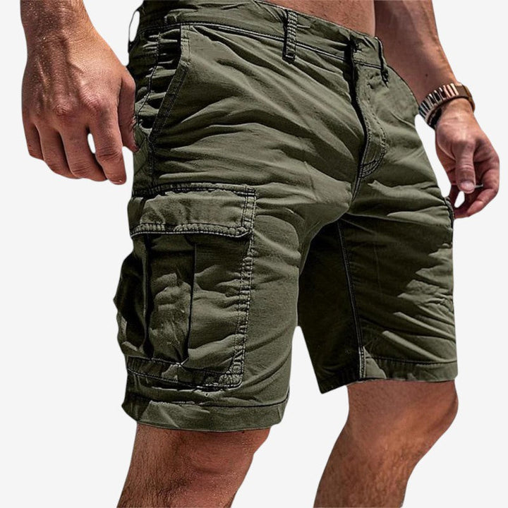 Men's green utility cargo shorts featuring multiple pockets