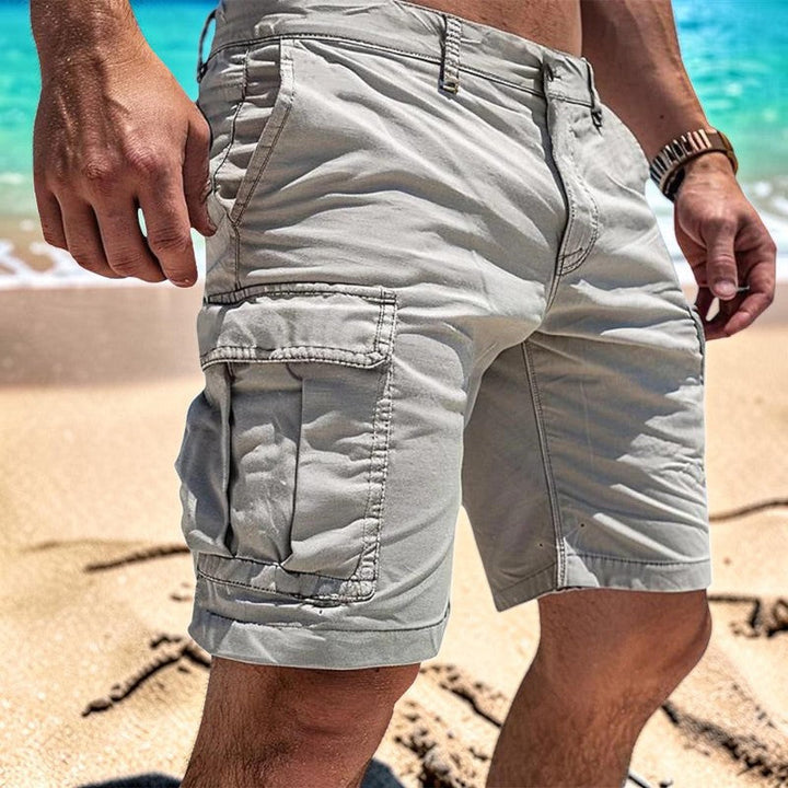 Close up view of multiple pockets on mens outdoor cargo shorts